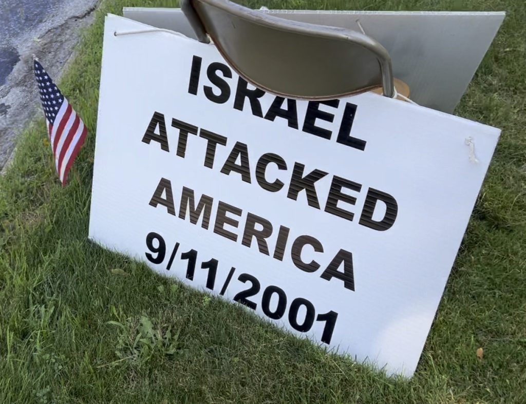 a sign reading "Israel Attacked America 9/11/2011" posted outside a synagogue in Ann Arbor, MI