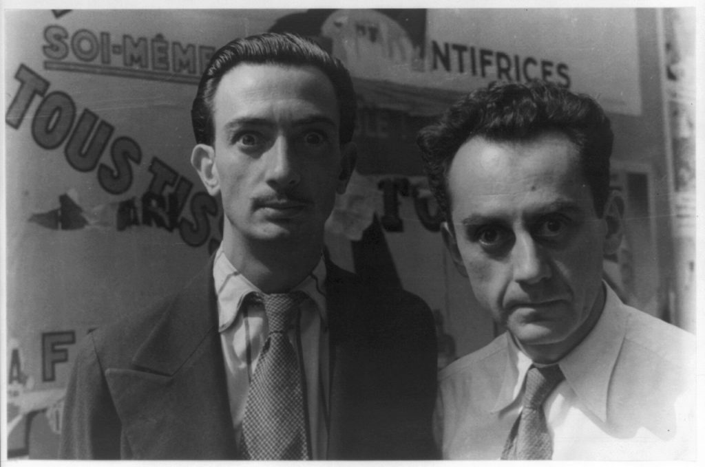A picture of Salvador Dali and Man Ray, both giving Crazy Eyes. This picture was probably taken at the Théâtre de la Gaîté-Montparnasse exhibition in Paris by Carl Van Vechten on June 16, 1934.