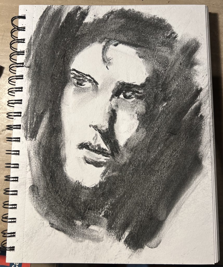 A sketched portrait of a man done in soft willow charcoal