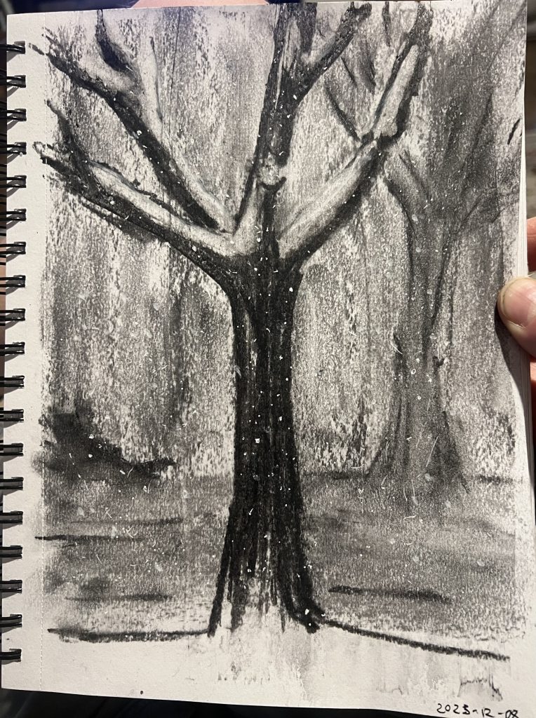 A charcoal sketch of a bare, snowy tree. Snow falls in the gloom.
